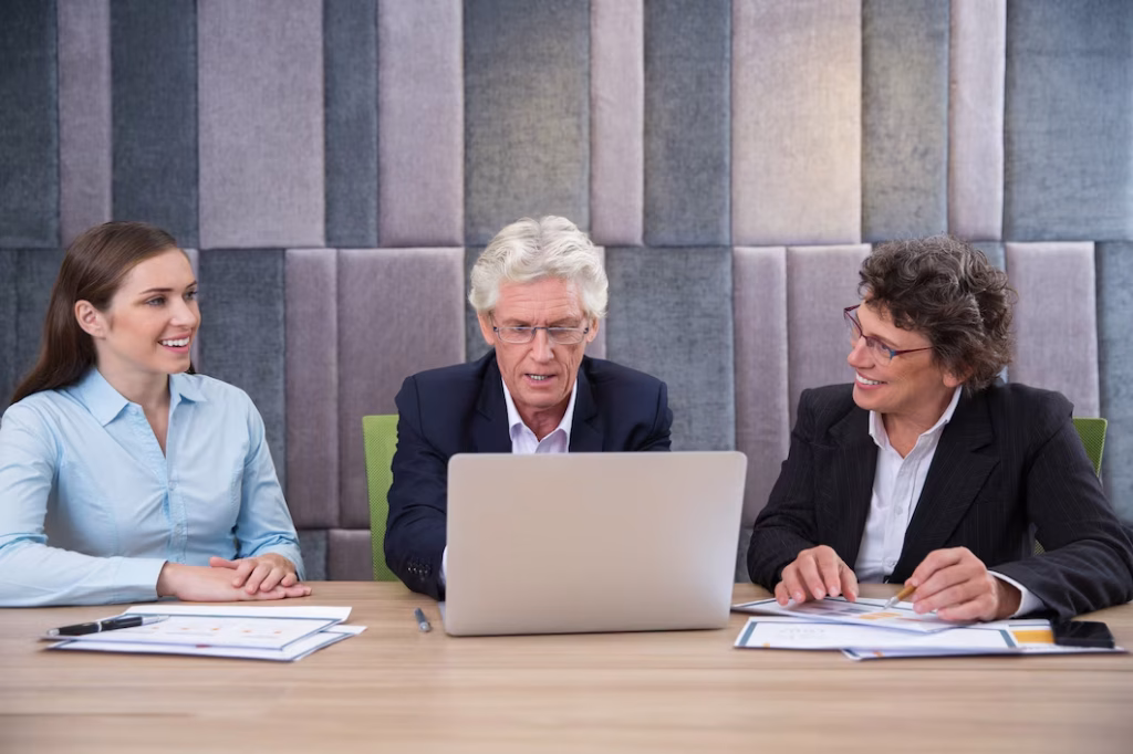 Two colleagues working together at a laptop
