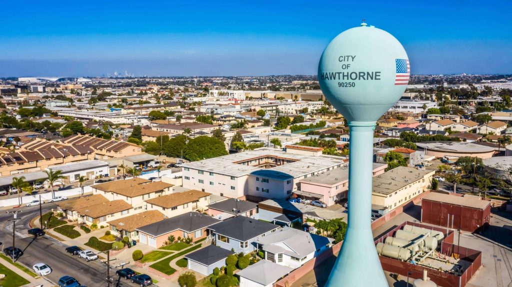 An aerial view of the City of Hawthorne water tower overlooking a residential neighborhood where a business lawyer in Hawthorne might serve the local community.