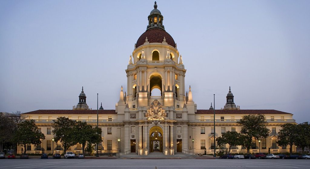 Pasadena City Hall with a large central dome and arched entrance at twilight, a landmark near a business lawyer in Pasadena.