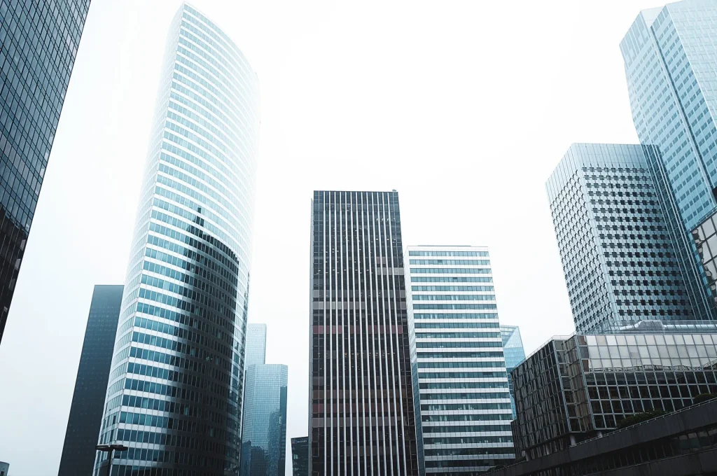 Modern glass office towers seen from below